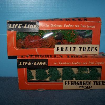 LOT 181 COLLECTABLE LIFE LIKE TREES in boxes