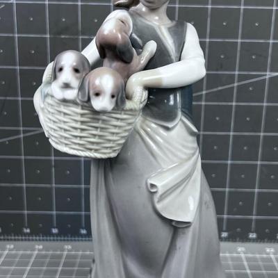 Lladro #1311   Titled: Girl with Basket of Puppies 