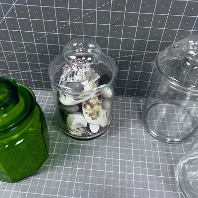 Covered Apothecary Jars one has Sea Shells. 