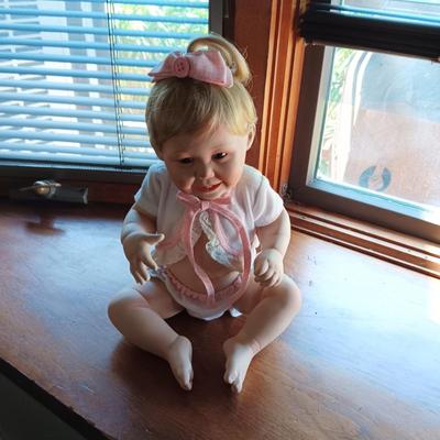ANTIQUE WICKER BABY BUGGY WITH PORCELAIN BABY DOLL