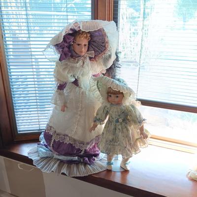 2 BEAUTIFUL PORCELAIN DOLLS