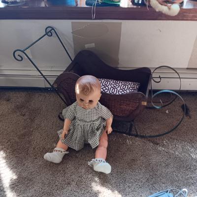 LARGE VINTAGE DOLL AND A WOODEN DISPLAY SLED