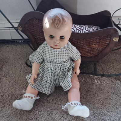 LARGE VINTAGE DOLL AND A WOODEN DISPLAY SLED