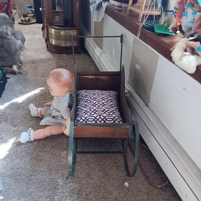 LARGE VINTAGE DOLL AND A WOODEN DISPLAY SLED