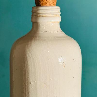 VINTAGE WHITE STONEWARE BOTTLE