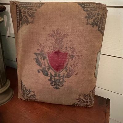 STRAW BASKET, PEACOCK PLATTER, PITCHER, ANDTIQUE PHOTO ALBUM & CANDLE LIGHT