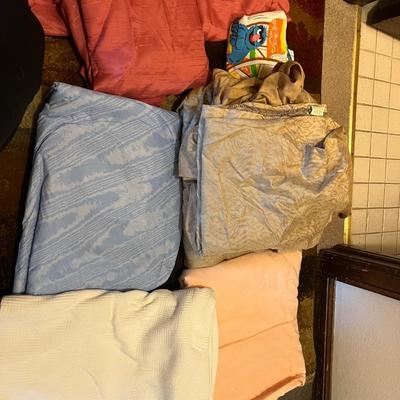 Assorted fabrics and bedding