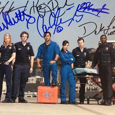 Trauma cast signed photo