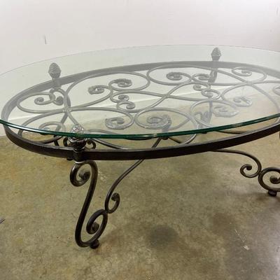 Oval Glass Top Coffee Table with Scrolling Metal Base