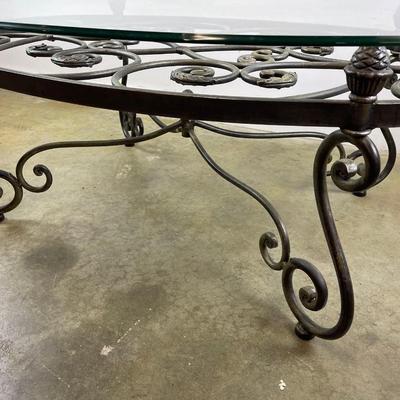 Oval Glass Top Coffee Table with Scrolling Metal Base