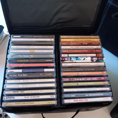 MUSIC ON CD's IN 2 CARRY CASES (1)