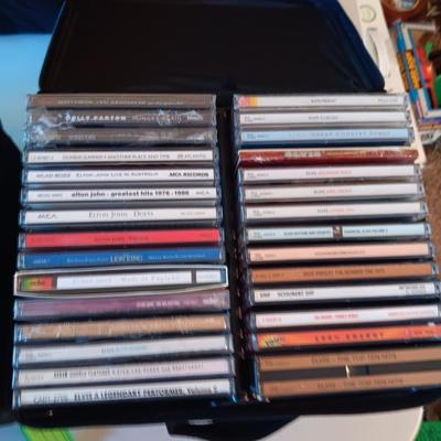 MUSIC ON CD's IN 2 CARRY CASES (2)