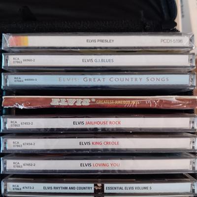 MUSIC ON CD's IN 2 CARRY CASES (2)