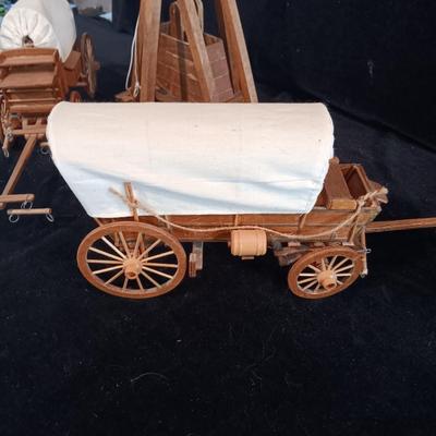 2 DECORATIVE COVERED WAGONS AND A TREBUCHET?