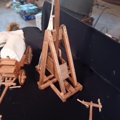 2 DECORATIVE COVERED WAGONS AND A TREBUCHET?