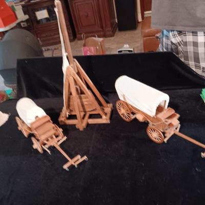 2 DECORATIVE COVERED WAGONS AND A TREBUCHET?