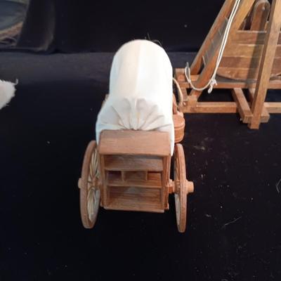 2 DECORATIVE COVERED WAGONS AND A TREBUCHET?