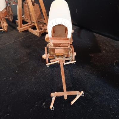 2 DECORATIVE COVERED WAGONS AND A TREBUCHET?