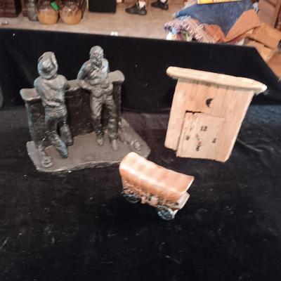 RED DOG SALOON STATUE, METAL COVERED WAGON COIN BANK AND OUTHOUSE CLOCK