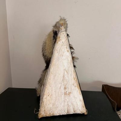 DECORATED BARK TEEPEE AND A HEADDRESS