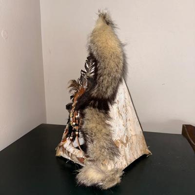 DECORATED BARK TEEPEE AND A HEADDRESS