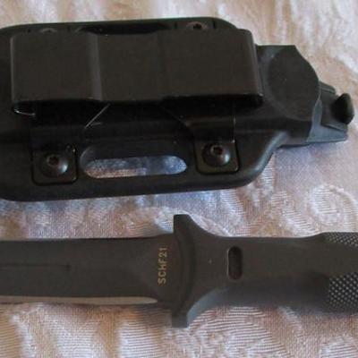 Schrade 1-piece, deep-forged, double-edged knife with hard plastic belt sheath