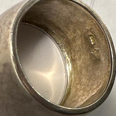 A 925 ring, loose stone, and choir pin