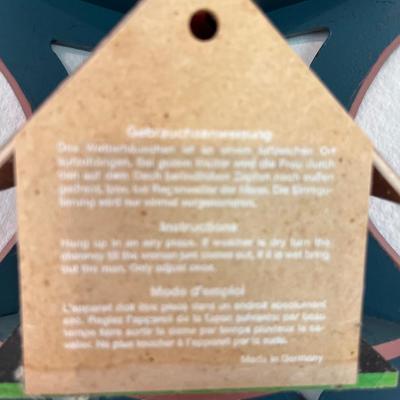 Corner shelf with carved man, egg cups, Crystal, bear and thermometer