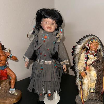 2 NATIVE AMERICAN STATUES WITH A PORCELAIN DOLL