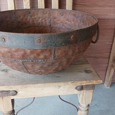 PRIMITIVE CAST IRON CAULDRON WITH IRON BAND AND HANDLES