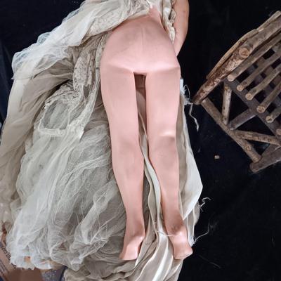 VINTAGE DOLL AND A CHAIR MADE OF TWIGS