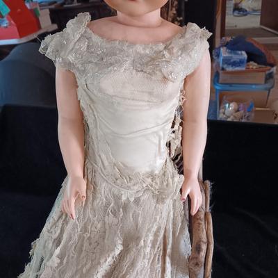 VINTAGE DOLL AND A CHAIR MADE OF TWIGS