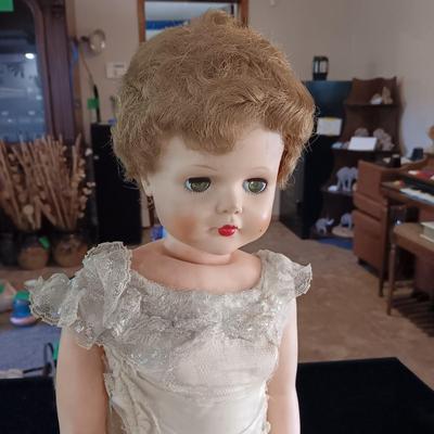 VINTAGE DOLL AND A CHAIR MADE OF TWIGS