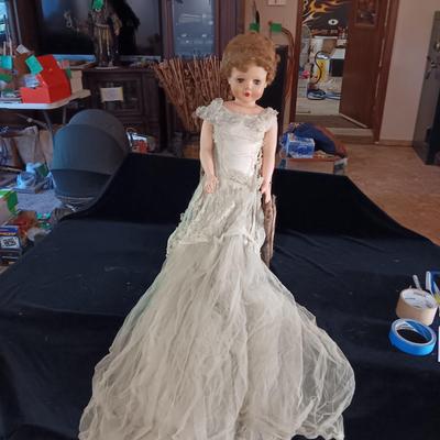 VINTAGE DOLL AND A CHAIR MADE OF TWIGS