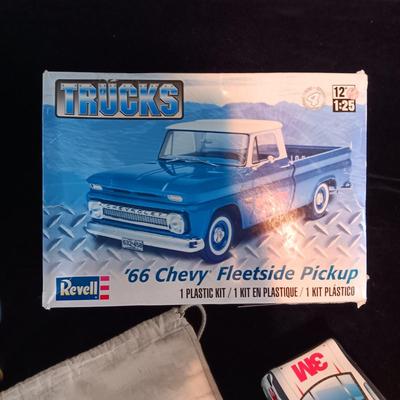 UNASSEMBLED MODEL TRUCK, ELVIS SIGNED BASEBALL, GAME SKUNK AND MORE