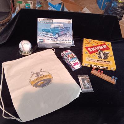UNASSEMBLED MODEL TRUCK, ELVIS SIGNED BASEBALL, GAME SKUNK AND MORE