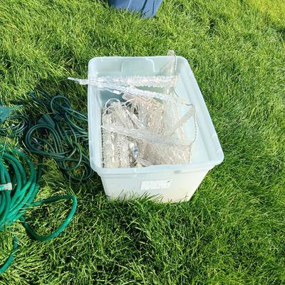 ROPE LIGHTS, OUTDOOR EXTENSION CORDS AND ICICLE LIGHTS ALL IN A STORAGE TOTE