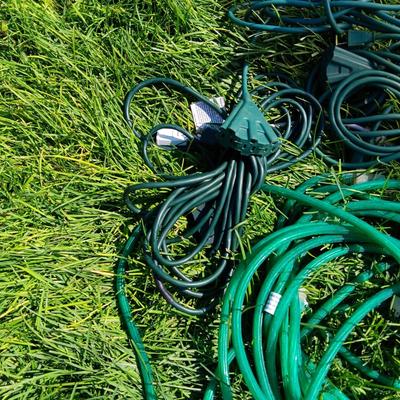 ROPE LIGHTS, OUTDOOR EXTENSION CORDS AND ICICLE LIGHTS ALL IN A STORAGE TOTE