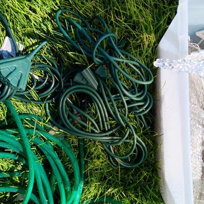 ROPE LIGHTS, OUTDOOR EXTENSION CORDS AND ICICLE LIGHTS ALL IN A STORAGE TOTE
