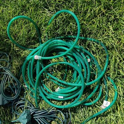 ROPE LIGHTS, OUTDOOR EXTENSION CORDS AND ICICLE LIGHTS ALL IN A STORAGE TOTE