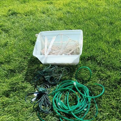 ROPE LIGHTS, OUTDOOR EXTENSION CORDS AND ICICLE LIGHTS ALL IN A STORAGE TOTE