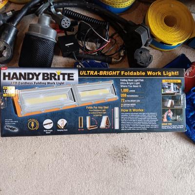 NEW FOLDABLE WORK LIGHT, NYLON STRAP, BOX OF DISPOSABLE GLOVES, 220 WATT PIGTAIL AND MORE