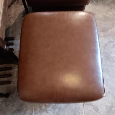 2 MATCHING VINYL OTTOMANS