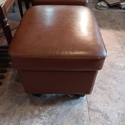 2 MATCHING VINYL OTTOMANS