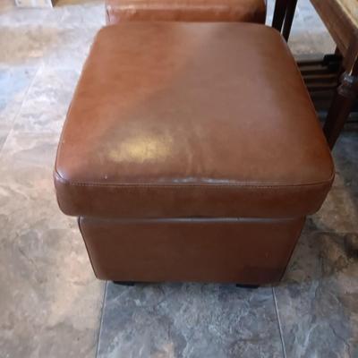 2 MATCHING VINYL OTTOMANS