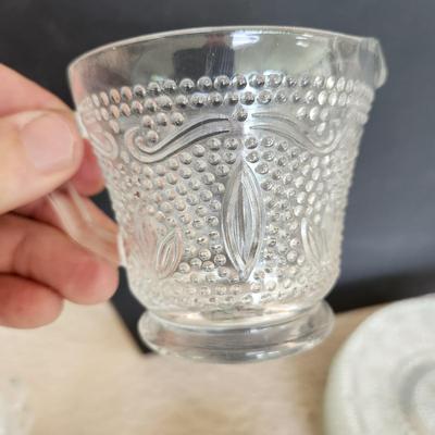 Large Collection of Depression Glass Daisy Plates, Cup, Saucer Bowls