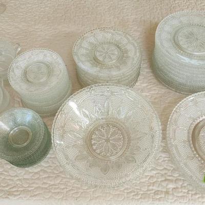 Large Collection of Depression Glass Daisy Plates, Cup, Saucer Bowls