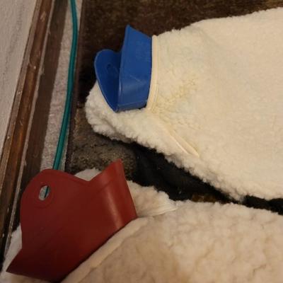 Assortment of towels, two hot water bags, shower curtain, hair clips