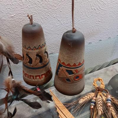 4 CLAY BELLS, PORCELAIN DOLL IN A SWING LIKE AND 2 STRAW & WHEAT ART PIECES