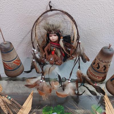 4 CLAY BELLS, PORCELAIN DOLL IN A SWING LIKE AND 2 STRAW & WHEAT ART PIECES